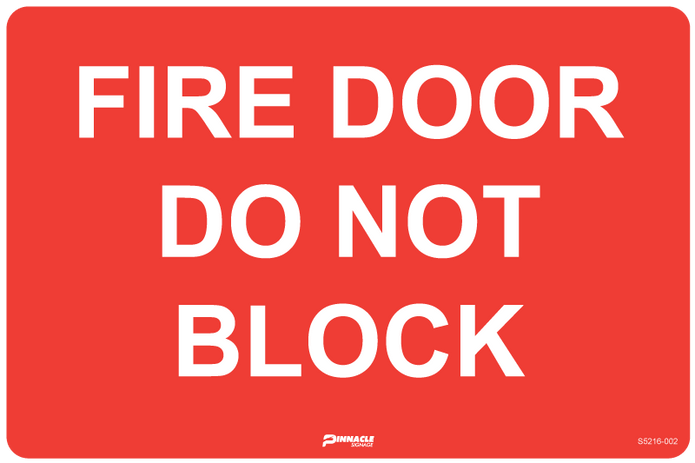 Fire Door Do Not Block sign in a commercial setting - fire and safety signs